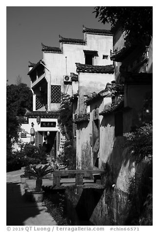Village street with stream. Xidi Village, Anhui, China (black and white)