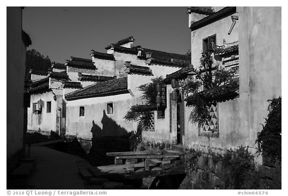 Street with bridges over stream. Xidi Village, Anhui, China (black and white)