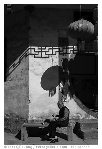 Elderly woman eating. Xidi Village, Anhui, China (black and white)