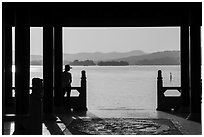 Man in Cuiguang Pavilion and West Lake. Hangzhou, China ( black and white)