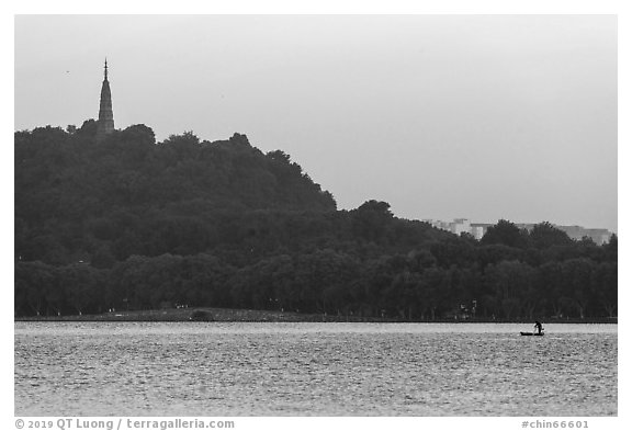 Boat and Baochu Pagoda at sunrise, West Lake. Hangzhou, China (black and white)