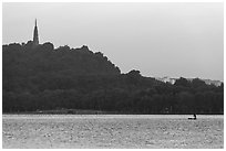 Boat and Baochu Pagoda at sunrise, West Lake. Hangzhou, China ( black and white)