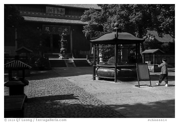 Woman offering incense, Jingci Temple. Hangzhou, China (black and white)