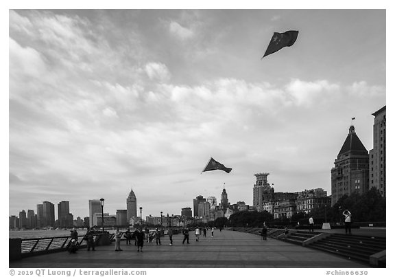 Chinese flats on kite lines, the Bund. Shanghai, China (black and white)