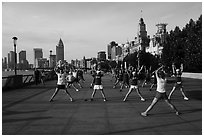 Morning group exercise on the Bund. Shanghai, China ( black and white)