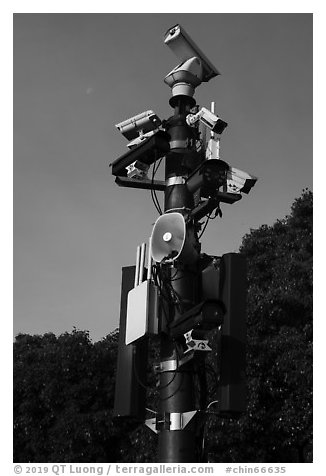 Surveillance cameras and speakers, the Bund. Shanghai, China (black and white)