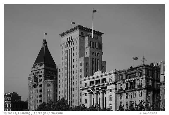 Colonial area buildings with Chinese flags. Shanghai, China (black and white)