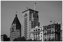 Colonial area buildings with Chinese flags. Shanghai, China ( black and white)