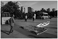 Man with kite on the ground, the Bund. Shanghai, China ( black and white)