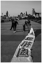 Men folding kite, the Bund. Shanghai, China ( black and white)