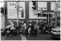 Motercycle riders waiting at trafic light. Shanghai, China ( black and white)