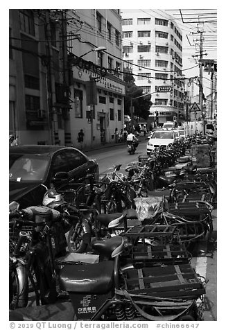 China Post motorbikes. Shanghai, China (black and white)