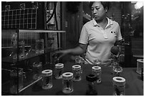 Woman selling insects. Shanghai, China ( black and white)