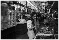 Young women shopping at Bird and Insect Market. Shanghai, China ( black and white)