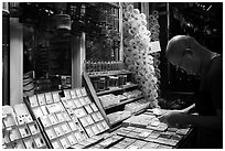 Man shopping at Bird and Insect Market. Shanghai, China ( black and white)