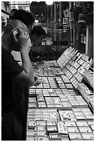 Man listening at insect. Shanghai, China ( black and white)