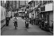 Old Street lined with old buidings and modern towers. Shanghai, China ( black and white)