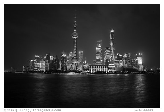 City skyline above Huangpu River at night. Shanghai, China (black and white)