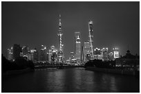 Garden Bridge, Peoples Memorial and city skyline at night. Shanghai, China ( black and white)