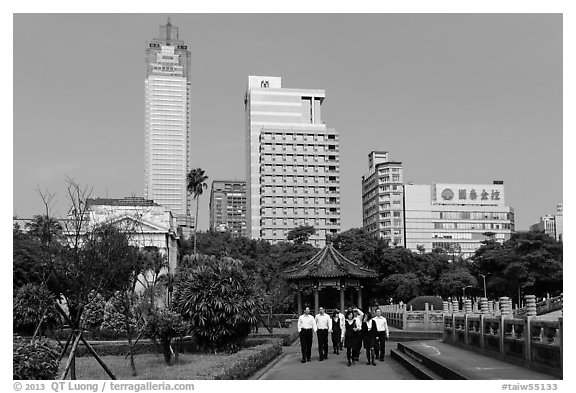 Office workers, 2-28 Peace Park, and high rises. Taipei, Taiwan (black and white)