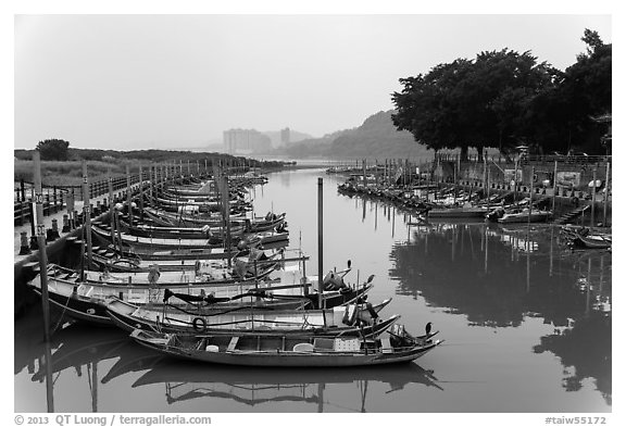 Small boat harbor along Damshui River. Taipei, Taiwan (black and white)