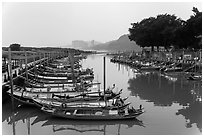 Small boat harbor along Damshui River. Taipei, Taiwan (black and white)