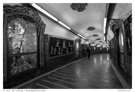 100 meter tunnel lined with brightly painted deities, Guandu Temple. Taipei, Taiwan (black and white)