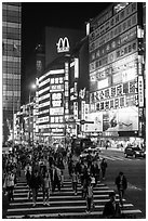 Pedestrian crossing by night and neon signs. Taipei, Taiwan (black and white)