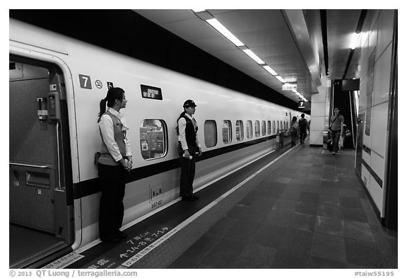 Hostess in front of High Speed Rail (HSR) car. Taipei, Taiwan (black and white)