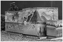 Decorated electric utilities boxes and wall. Taipei, Taiwan ( black and white)