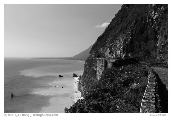 Road atop steep see cliffs overlooking ocean. Taroko National Park, Taiwan (black and white)