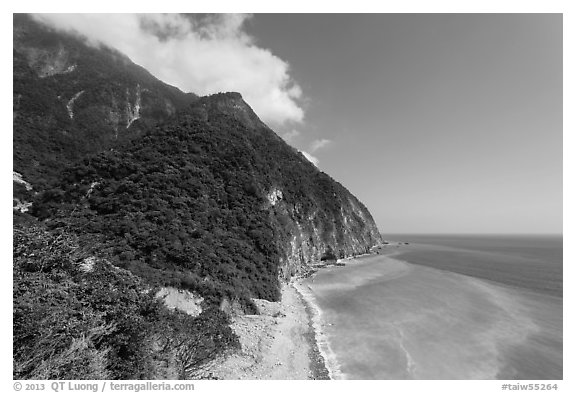 Lush mountains drop into azure ocean. Taroko National Park, Taiwan (black and white)