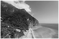 Lush mountains drop into azure ocean. Taroko National Park, Taiwan (black and white)