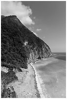 Lush high hills drop into turquoise ocean. Taroko National Park, Taiwan (black and white)