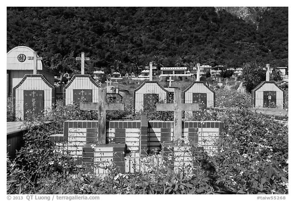 Tombs below lush cliff, Chongde. Taiwan