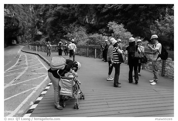 Tourists wearing park-provided helmets for safety. Taroko National Park, Taiwan (black and white)