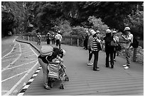 Tourists wearing park-provided helmets for safety. Taroko National Park, Taiwan ( black and white)