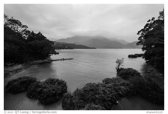 Cove with floating rafts on which plants are being grown. Sun Moon Lake, Taiwan (black and white)