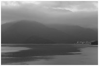 Itashao Village and cloud-shrounded mountains at dawn. Sun Moon Lake, Taiwan ( black and white)