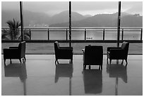 Chairs in hotel lobby with view of lake. Sun Moon Lake, Taiwan ( black and white)