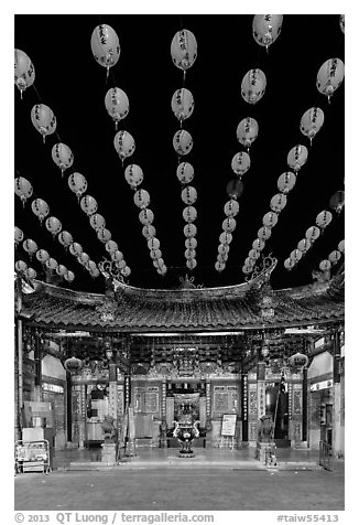 Array of red paper lanterns and temple at night. Lukang, Taiwan