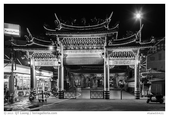Temple gate and convenience store at night, Matzu Temple. Lukang, Taiwan (black and white)