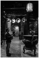 Man praying to Matsu, Tienhou Temple. Lukang, Taiwan (black and white)