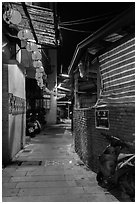 Chinseng Lane at night with lanterns. Lukang, Taiwan (black and white)