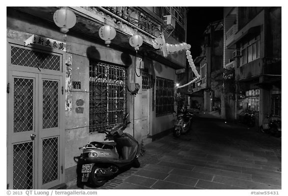 Nine-turns lane with red paper lanterns at night. Lukang, Taiwan (black and white)