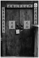 Wooden door traditional lock and chinese inscription on red paper. Lukang, Taiwan (black and white)