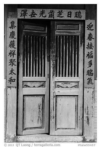 Wooden door with chinese script on red paper. Lukang, Taiwan (black and white)