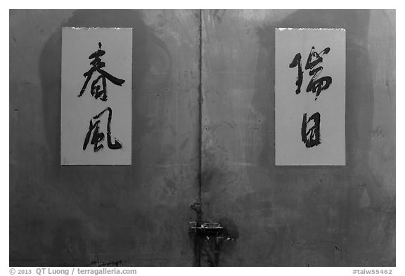 Blue door detail wiht Chinese script on red. Lukang, Taiwan (black and white)