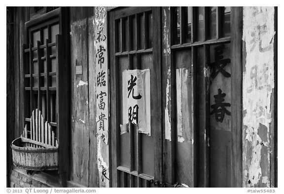 Weathered inscriptions on door. Lukang, Taiwan (black and white)