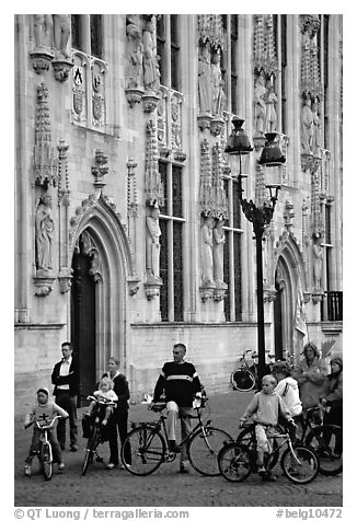 People standing on the Burg, in front of the Stadhuis. Bruges, Belgium (black and white)